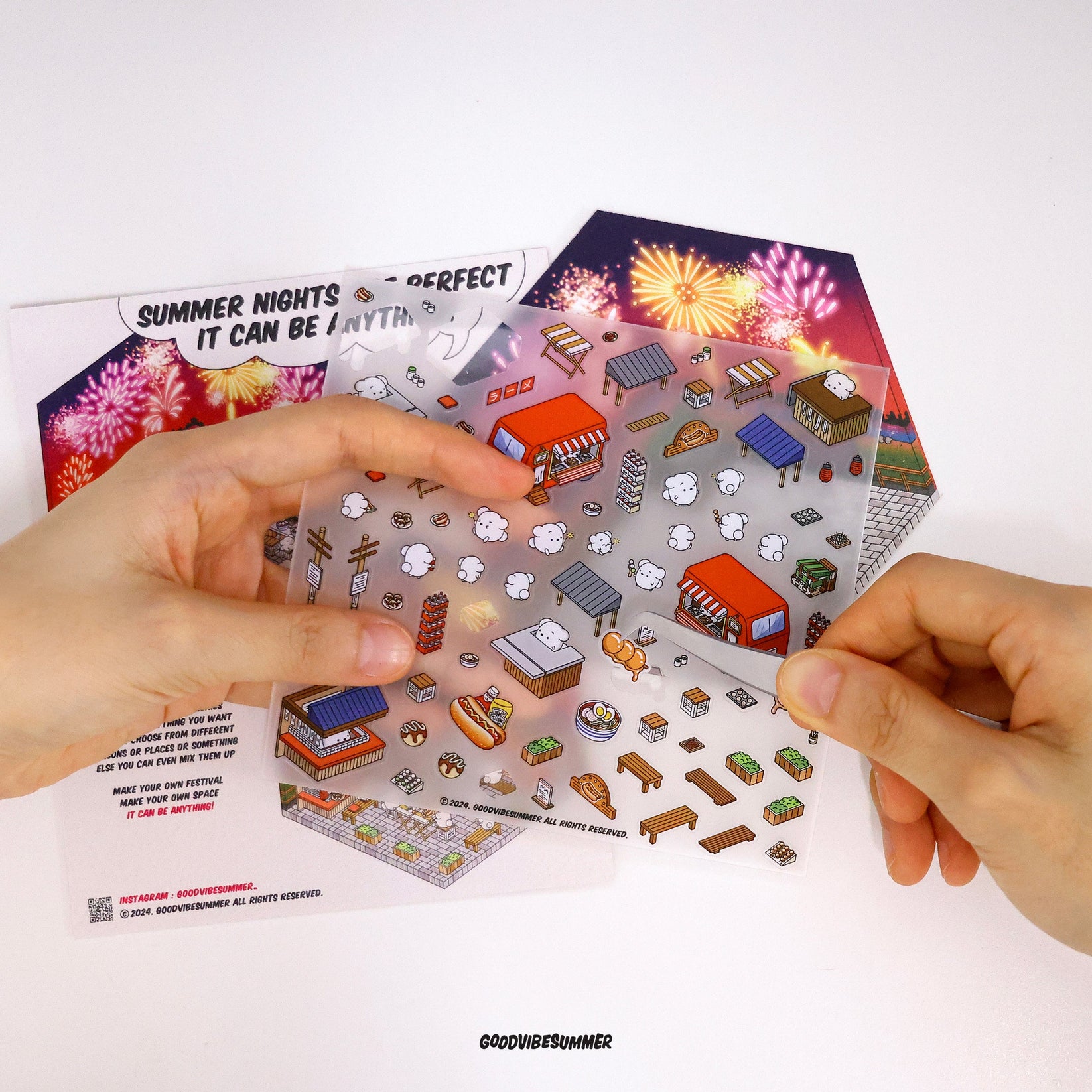 Hands placing stickers onto a scene
